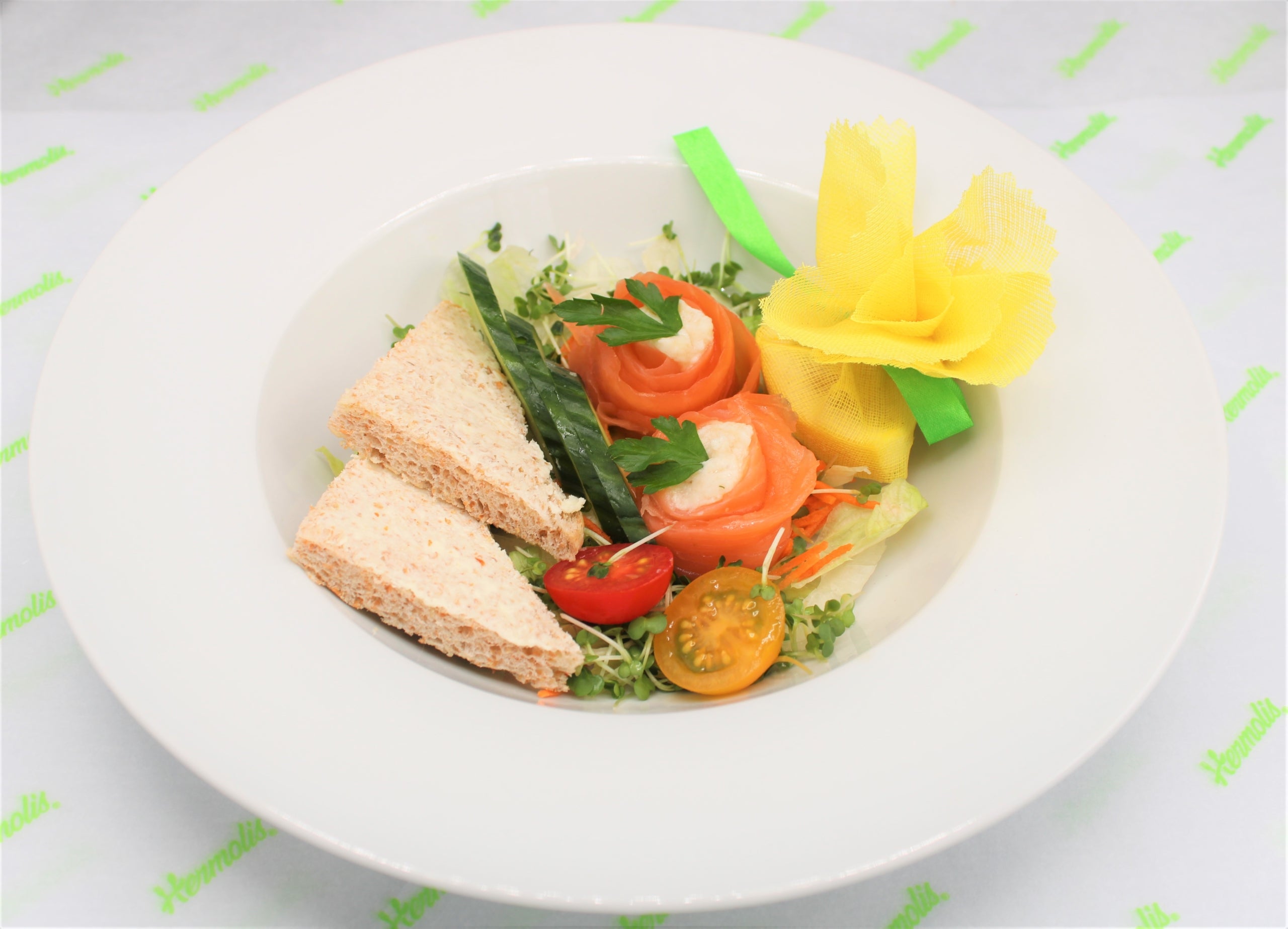 Rosettes of Smoked Salmon Garnished with Capers , Served on a Bed of Mixed Leaf Salad With Horseradish & Brown Bread