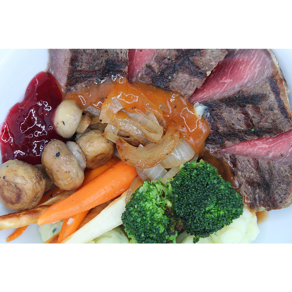 Pan Fried Fillet of Beef served with Potato & Parsley Puree, Roasted Parsnip, Mushrooms, Fried Onions, Carrots & Broccoli