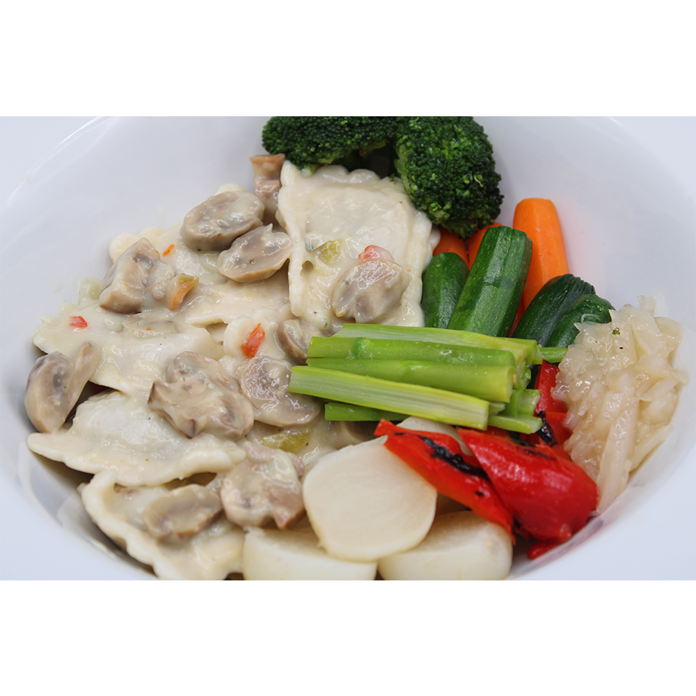 Vegetarian Ravioli in a Creamy Mushroom Sauce with Sliced Asparagus and Fresh Garden Vegetables
